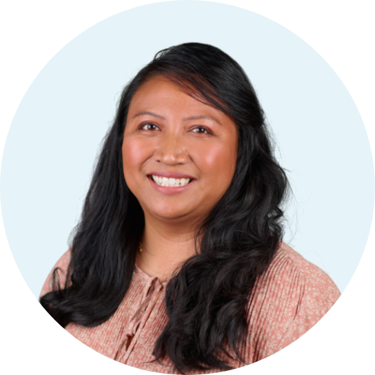 Headshot of Christine Domingo in a light blue circular frame.